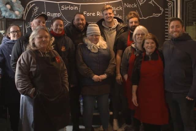 Sunderland AFC boss Lee Johnson (right) with members of the Roker Report team and Soup Kitchen workers including founder Andrea Bell (centre)