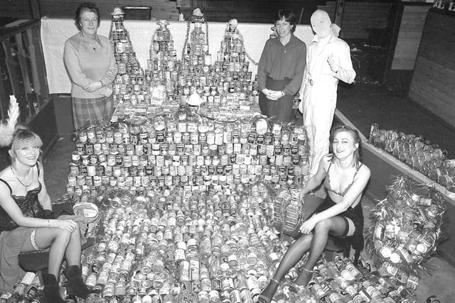 Annabel's nightclub down the town was once the place to be, whether it was for a '70s disco night or a festive fancy dress. At Christmas the admission price used to be an item of food, usually a can, which would be donated to a good cause. Pictured here is staff counting up the collection on January 3 1981. Left to right; Mrs Bloomfield and Mrs Thompson of the Social Services, and Mr Barnwell, manager of Annabel's.  Front (left to right) are Annabel' staff in fancy dress, Mrs Patricia Barnwell and Miss Sue Barrass.
