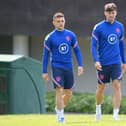 Kieran Trippier and John Stones of England look on during an England Training Session at St Georges Park on June 03, 2022 in Burton-upon-Trent, England. (Photo by Shaun Botterill/Getty Images)
