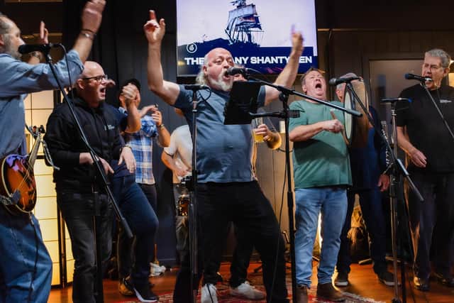 Bill Bailey (centre) sings with the Albany Shantymen during his Australian Adventure (Picture: Perpetual Entertainment/Marmalade Sky/Channel 4)