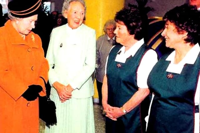 Her Majesty admires the uniforms of the WRVS in the company of chair of the Friends of Sunderland Health Services Greta Kirby and volunteers Dorothy Cockton and Zena Saltzer.
