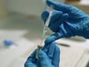 A needle is filled from a phial of Pfizer/BioNTech Covid-19 vaccine at the Royal Victoria Infirmary in Newcastle, on the first day of the largest immunisation programme in the UK's history.