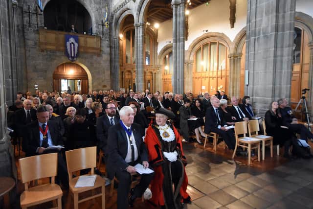 The community joins together in tribute to Queen Elizabeth II at Sunderland Minster.