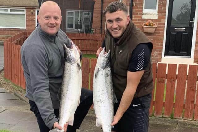 Connor Bell  and Michael Hutchinson posing with their illegal haul of salmon.