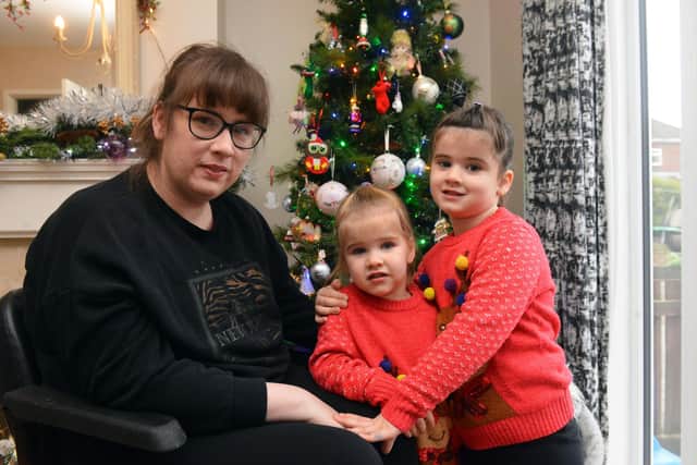 Sarah Ross who suffered a stroke at home with her children Amelia, five and Isabella, three.