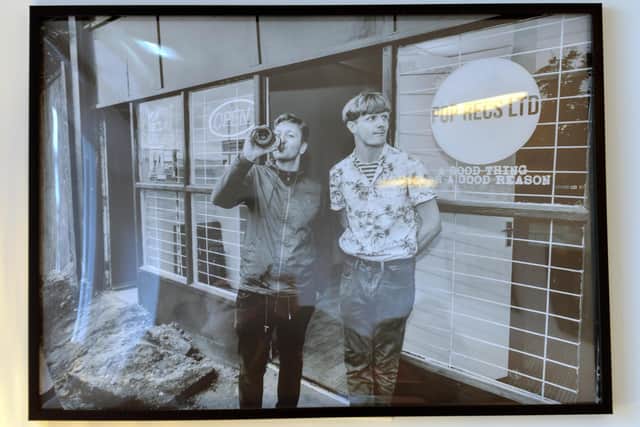 Pictures of the late Dave Harper adorn the walls. He's pictured here with co-founder Michael McKnight, right.