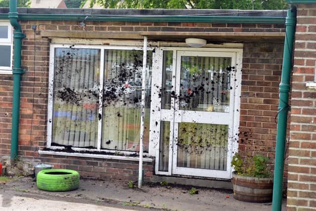 Vandals smeared mud across the building are destroying the garden at the school.