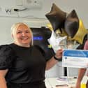 Roanna Williamson receives a certificate from the Cumbria, Northumberland, Tyne and Wear NHS Foundation Trust's chief executive James Duncan.