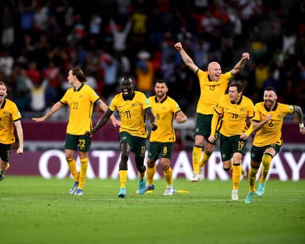 Australia celebrate after defeating Peru in the 2022 FIFA World Cup play-off match between Australia Socceroos and Peru. (Photo by Joe Allison/Getty Images).