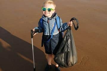 The pair managed to fill a bin liner as they walked along the beach.