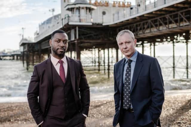 Richie Campbell as Detective Sergeant Glenn Branson and John Simm as Detective Superintendent Roy Grace in ITV's new drama Grace, an adaptation of the Peter James books  Dead Simple and Looking Good Dead.