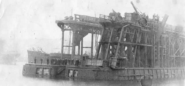 The photograph shows Tongue Jetty coal staiths after a mishap in 1893. Note the ferry steps at the end.