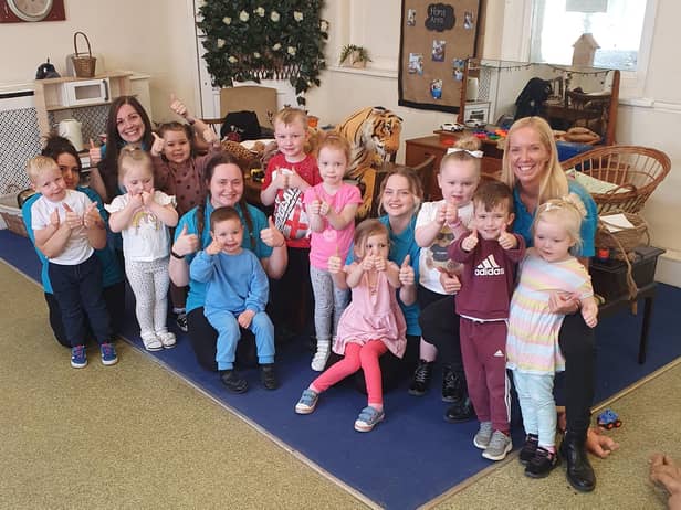 Staff and children at Apple Blossom Day Nursery on Durham Road celebrate their good Ofsted inspection.