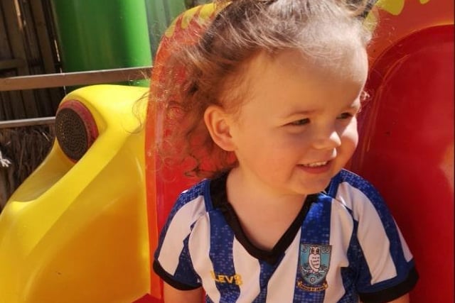 "Poppy-Rose, three, rocking her Wednesday top on holiday," said Kelly Marie Macdonald.