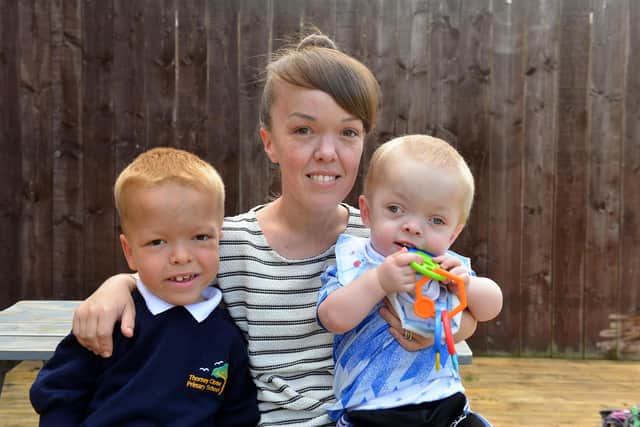 Laura Phillips with sons Nathan and Jax.