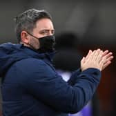 SUNDERLAND, ENGLAND - JANUARY 11: Sunderland manager Lee Johnson applauds the fans wearing a face mask during the Sky Bet League One match between Sunderland and Lincoln City at Stadium of Light on January 11, 2022 in Sunderland, England. (Photo by Stu Forster/Getty Images)