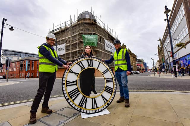 Sunderland City Councillor Rebecca Atkinson (centre) with Mackies Corner Principal Conservation Office Mark Taylor (left) and site manager David Tait (right and one of the new clock faces.