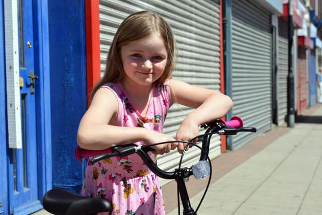 Kasie Williams had her bike stolen from Aldi, so staff there paid to buy her a new one. Picture by Stu Norton.