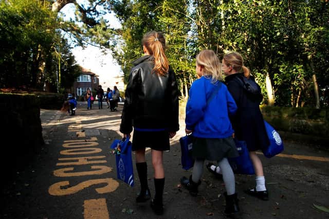 Children walk home from school after the government's policy to close all schools on March 20 (Photo: Clive Brunskill/Getty Images)