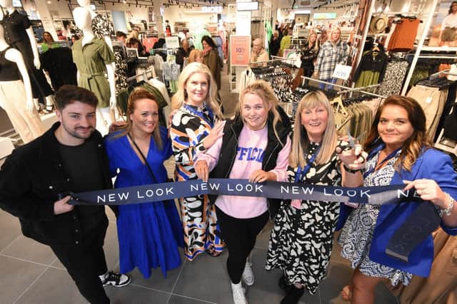 Jeanette Conlon cuts the ribbon at the opening at the new Bridges New Look store watched by (from left)Thomas Skidmore, manager; Sarah Fuller, Territory Leader; Claire Chapman, Territory Support manager; first customer Courtney Wheldon and sales advisor Pauline Wheatley