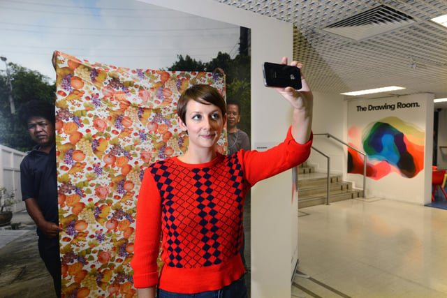 Rebecca Travis takes a "selfie" at the "You Are The Company In Which You Keep" exhibition at the Northern Gallery for Contemporary Art, Fawcett Street, in 2013.