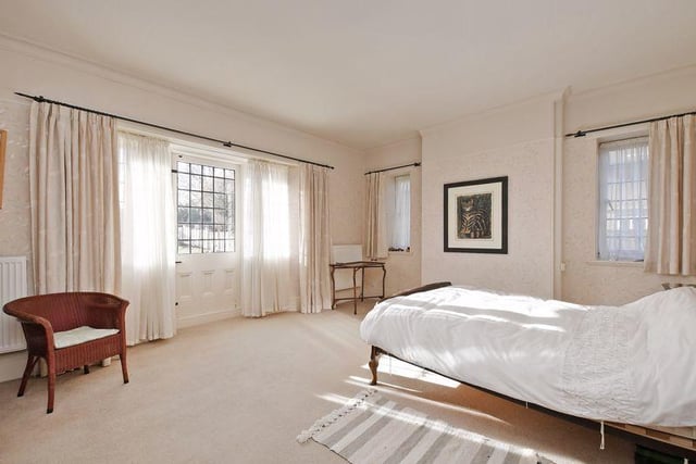 The master bedroom suite has a dressing room, en-suite bathroom and parquet flooring. The bedroom is bright and airy with two side windows and a door which opens onto the balcony to the rear.