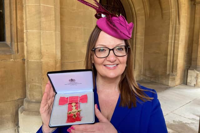 Wendy Price with her OBE at Windsor Castle.