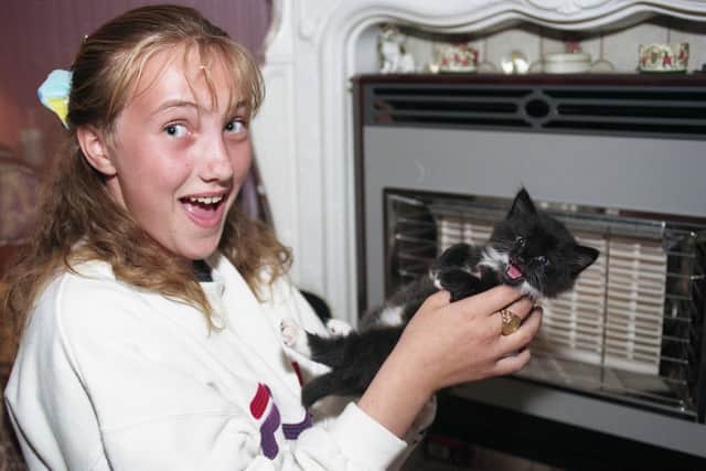 Gemma Cubby with the six week old kitten Lucy after firefighters rescued her from behind her owner's fireplace.