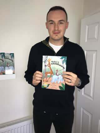 Liam Murphy with his bestselling book.