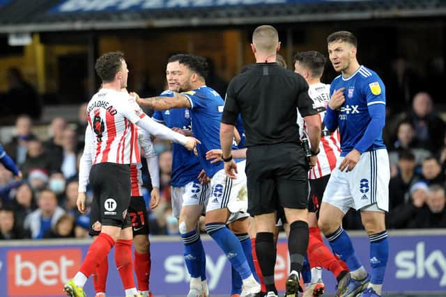 Ipswich and Sunderland players clash.