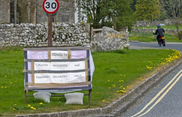 Signs in the Malham area of the Yorkshire Dales ask visitors to stay away following the March 23 coronavirus lockdown. Picture Tony Johnson