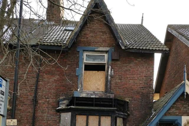 Cllr Michael Dixon outside the property in Tunstall Terrace.