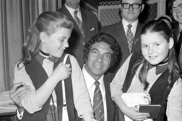 Singer Frankie Vaughan signing his autograph for two young admirers in the Seaburn Hotel in 1970.