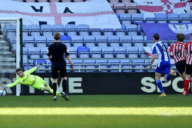 Lee Burge makes a save during Wigan Athletic's win at the DW Stadium