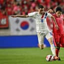 Paraguay's Miguel Almiron (L) fights for the ball with South Korea's Na Sang-ho (R) during a friendly football match between South Korea and Paraguay in Suwon on June 10, 2022. (Photo by Jung Yeon-je / AFP) (Photo by JUNG YEON-JE/AFP via Getty Images)