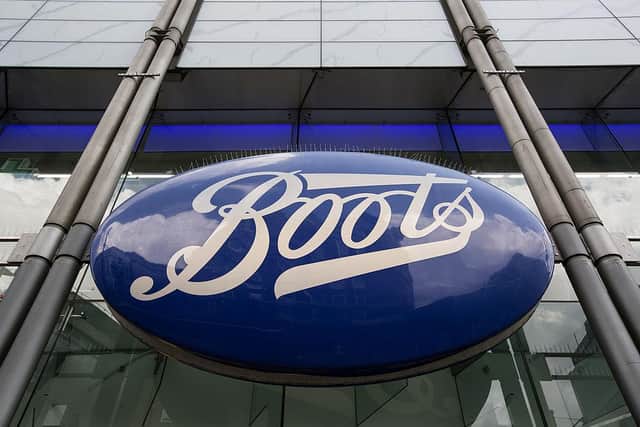 The sign for a branch of Boots the chemist  (Photo by Oli Scarff/Getty Images)