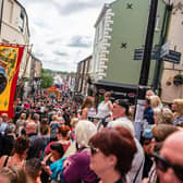 Banners march over Elvet Bridge at the 2019 Durham Miners Gala.