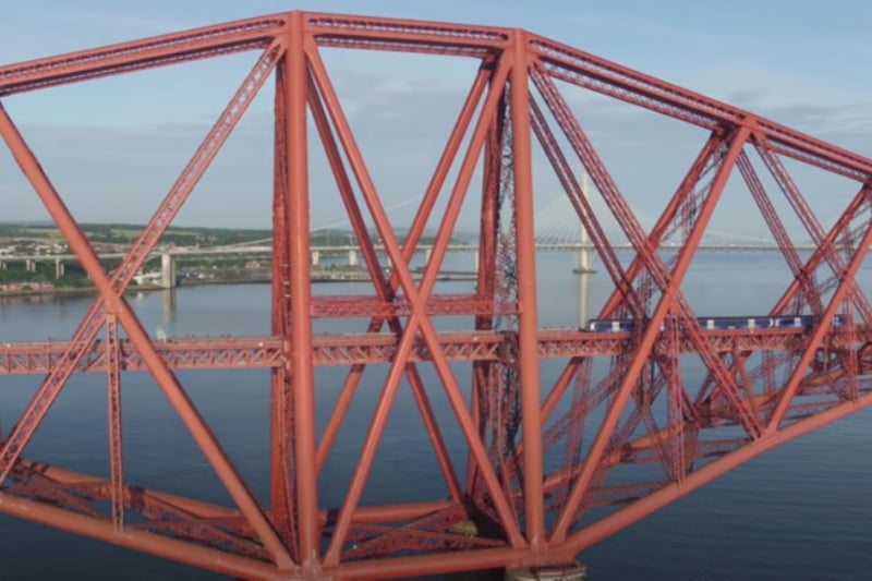 A train crosses the iconic Forth Bridge connecting Edinburgh and Fife.