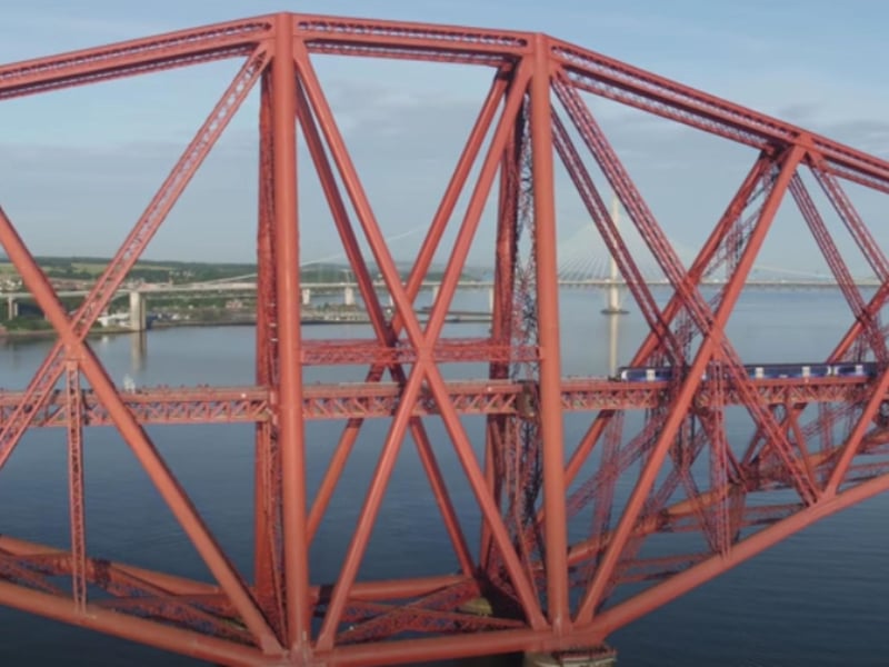 A train crosses the iconic Forth Bridge connecting Edinburgh and Fife.