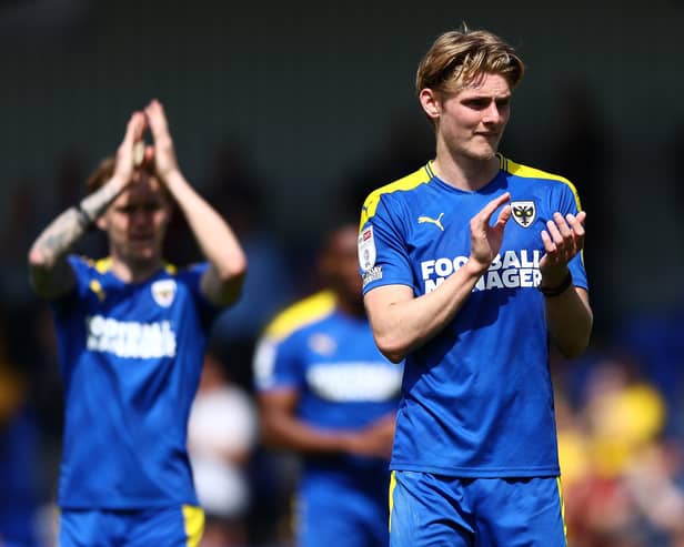 WIMBLEDON, ENGLAND - APRIL 30: Jack Rudoniof AFC Wimbledon  acknowledges the fans after AFC Wimbledon were relegated from League One during the Sky Bet League One match between AFC Wimbledon and Accrington Stanley at Plough Lane on April 30, 2022 in Wimbledon, England. (Photo by Bryn Lennon/Getty Images)