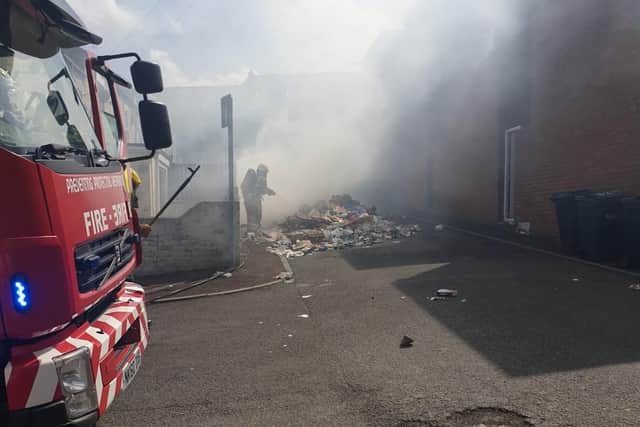 Firefighters tackle burning waste tipped out by Gateshead bin lorry (image Gateshead Council)
