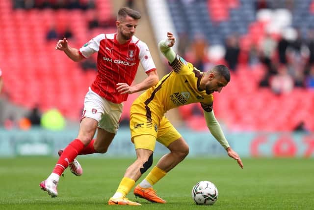 Omar Bugiel of Sutton United holds off Dan Barlaser of Rotherham United during the Papa John's Trophy Final. (Photo by Catherine Ivill/Getty Images)