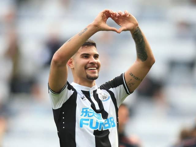 Newcastle United's Brazilian midfielder Bruno Guimaraes celebrates on the pitch after the English Premier League football match between Newcastle United and Leicester City at St James' Park in Newcastle-upon-Tyne, north east England on April 17, 2022. (Photo by LINDSEY PARNABY/AFP via Getty Images)