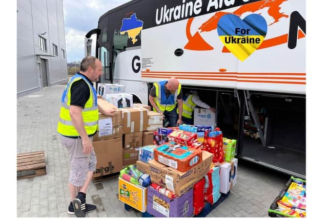 Unloading aid close to the Ukraine border.