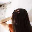 Stock image of a resident coping with mould.
