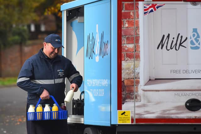 A milkman delivering milk from Milk & More, as thousands of people have returned to having their milk delivered as they are forced to stay at home during the coronavirus outbreak. PA Photo.