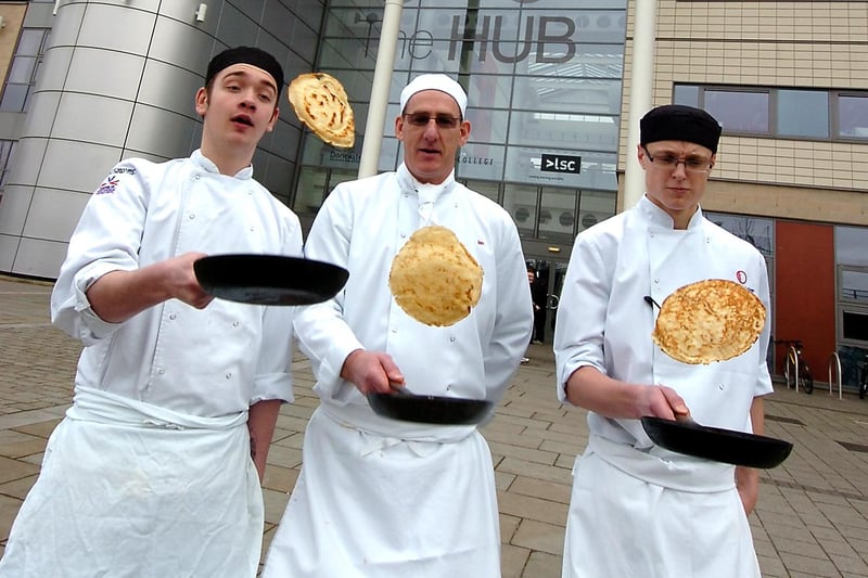 The Hub cookery students,from left, Lewis Pilsworth, aged 17, of Misson,  Ian Ellison, aged 49, of Doncaster, and Josh Raybould-Cridge, aged 18, of Wheatley Hills, tossed their pancakes in 2009