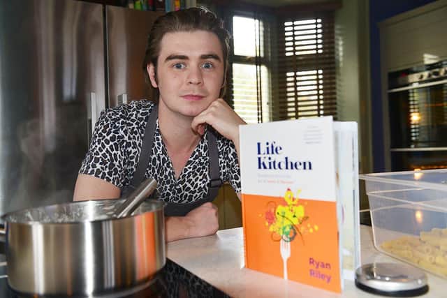 Chef Ryan Riley alongside his book Life Kitchen. Picture by FRANK REID
