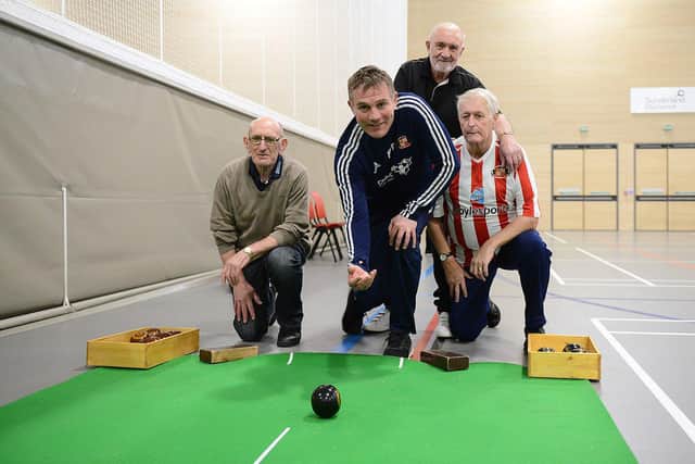 Sunderland AFC Manager Phil Parkinson playing carpet bowls with (left to right) Keith Wilkinson, Dave Davison and John Heppell during the EFL Day of Action held at the Beacon of Light.