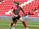 SUNDERLAND, ENGLAND - MAY 09: Denver Hume of Sunderland in action during the Sky Bet League One match between Sunderland and Northampton Town at Stadium of Light on May 09, 2021 in Sunderland, England. (Photo by Pete Norton/Getty Images)
